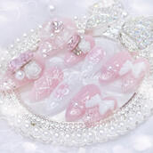 Custom japanese handmade press-on nail set by Kei Atelier, featuring a white and pink design with a lattice design, white and pink ribbon bow charms, roses, and rhinestones, jirai ryousangata princess coquette aesthetic, rose of versailles inspired marie a